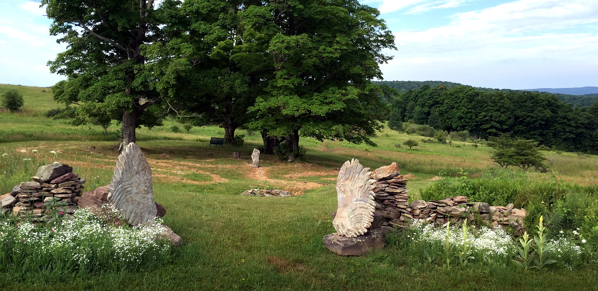 Hand-carved fossilized bluestone Angel Wings and Labyrinth Bobby Jacobs