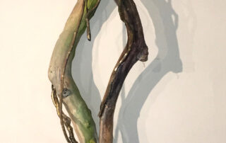 "Survival," Assemblage with found wood, cast bronze branches, oil paint, 42 x 10 x 9 inches